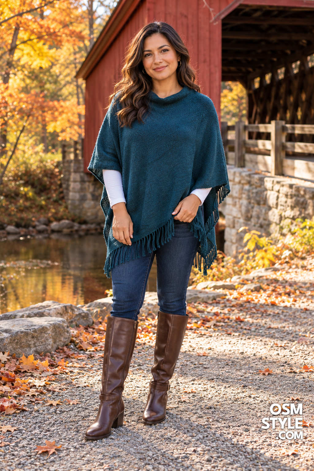 25. Teal Poncho With Skinny Jeans And Boots